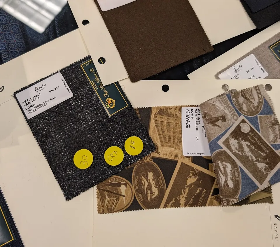 Fabric reference with buyer markings from a buying appointment.